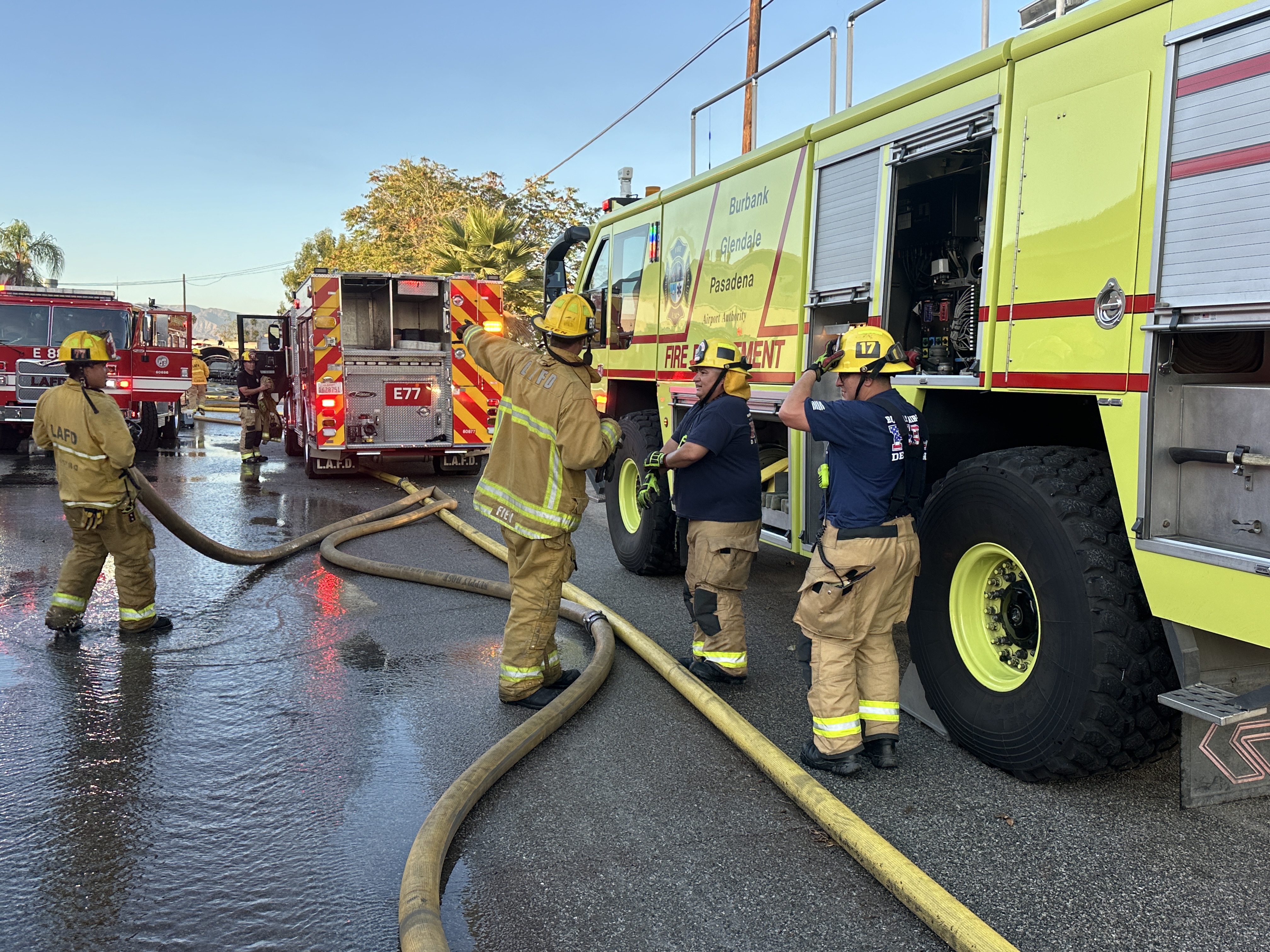 Airport foam tender assisting LAFD firefighter